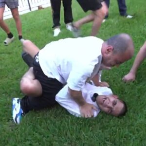 N3on wrestles a dwarf and is taken down with ease