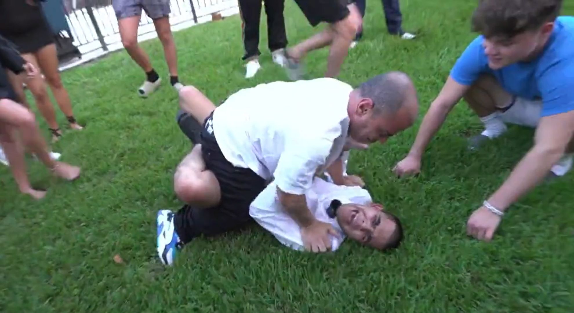 N3on wrestles a dwarf and is taken down with ease