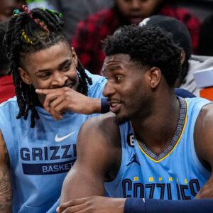 Memphis Grizzlies guard Ja Morant (12) and forward Jaren Jackson Jr. (13) react ons the bench during the game against the Atlanta Hawks during the second half at State Farm Arena.