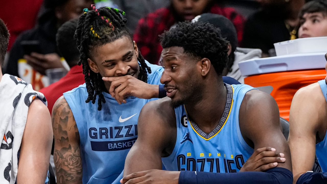Memphis Grizzlies guard Ja Morant (12) and forward Jaren Jackson Jr. (13) react ons the bench during the game against the Atlanta Hawks during the second half at State Farm Arena.