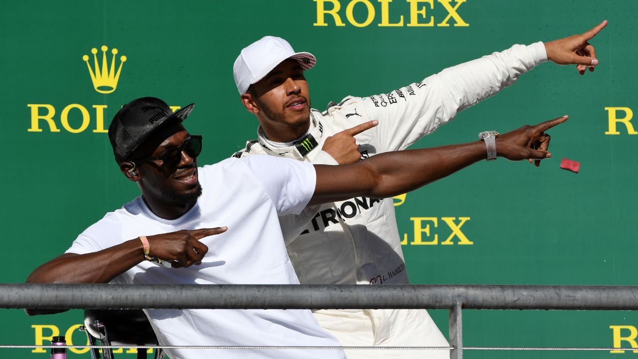 Usain Bolt Waves the Lewis Hamilton Flag While Daring Mercedes for Next Season