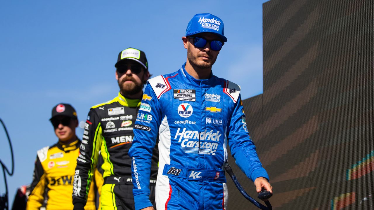 Nov 5, 2023; Avondale, Arizona, USA; NASCAR Cup Series drivers Kyle Larson (right) with Ryan Blaney (center) and Christopher Bell during the Championship Race at Phoenix Raceway. Mandatory Credit: Mark J. Rebilas-USA TODAY Sports
