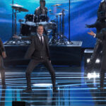 An image showing Sam Lake, Ilkka Villi, and David Harewood on stage of The Game Awards 2023 dancing to Herald of Darkness