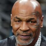 “Evander Must Be Crying”: Mike Tyson Promoting Cannabis Venture in a Lab Coat Has Fans in Hysterics
