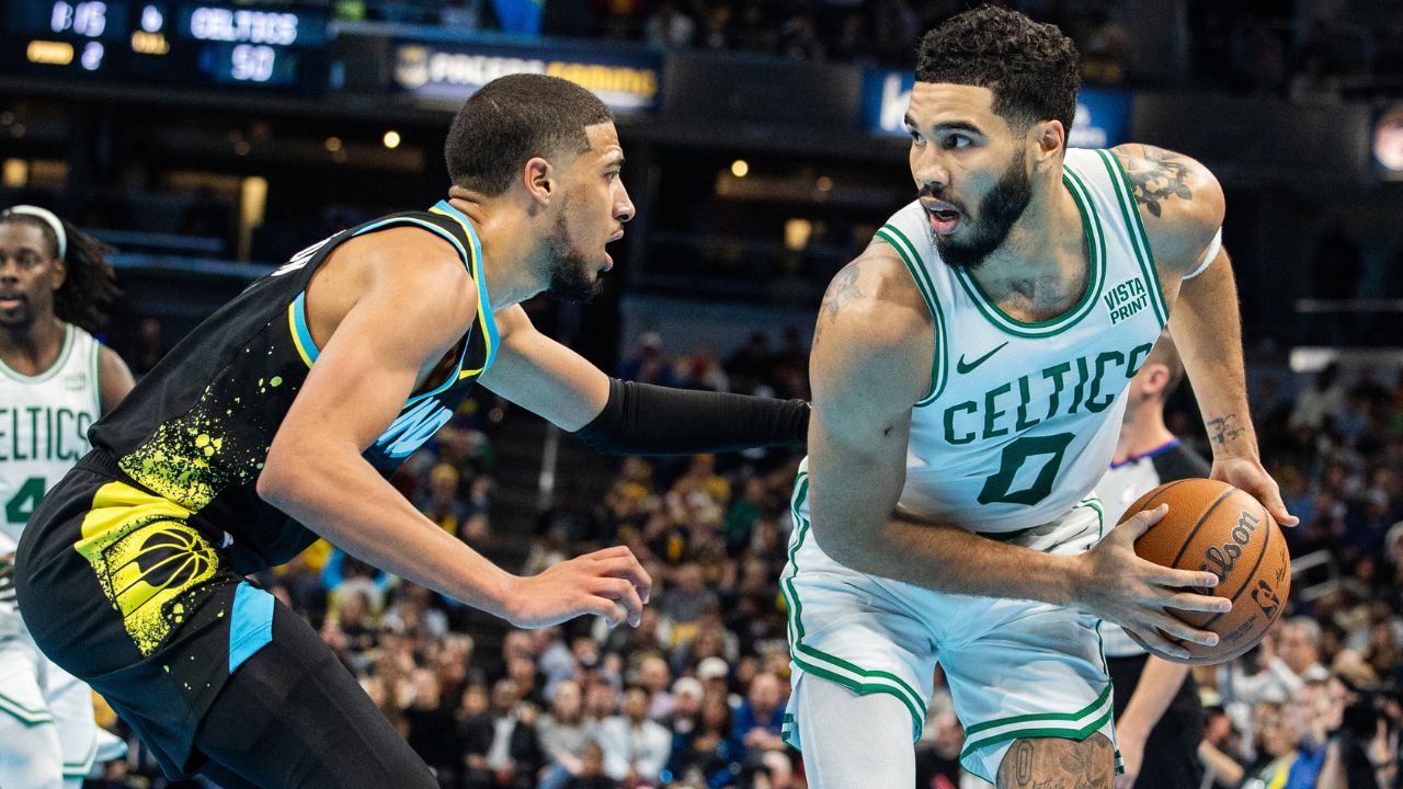 Dec 4, 2023; Indianapolis, Indiana, USA; Boston Celtics forward Jayson Tatum (0) holds the ball while Indiana Pacers guard Tyrese Haliburton (0) defends in the first half at Gainbridge Fieldhouse. Mandatory Credit: Trevor Ruszkowski-USA TODAY Sports