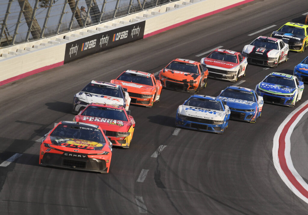 ATLANTA, GA - FEBRUARY 25: Martin Truex Jr 19 Joe Gibbs Racing Bass Pro Shops Toyota leads Todd Gilliland 38 Front Row Motorsports Georgia Peanuts Ford during the running of the NASCAR, Motorsport, USA Cup Series Ambetter Health 400 on February 25, 2024, at Atlanta Motor Speedway in Hampton, GA. Photo by Jeffrey Vest/Icon Sportswire AUTO: FEB 25 NASCAR Cup Series Ambetter Health 400 EDITORIAL USE ONLY Icon2402251989