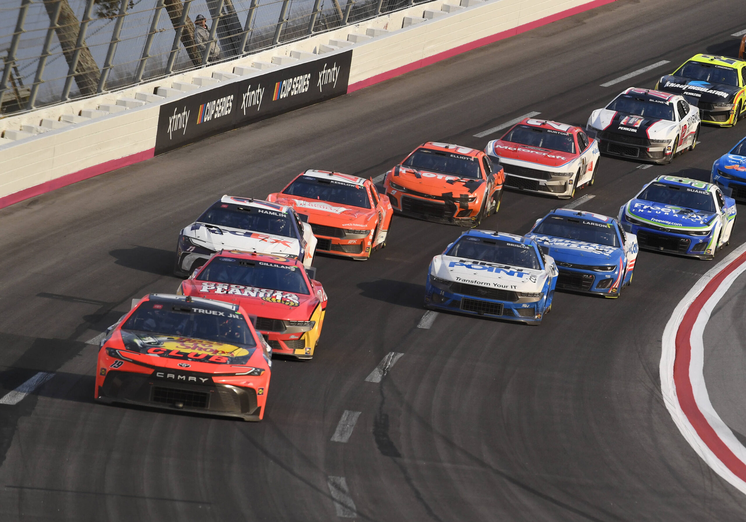 ATLANTA, GA - FEBRUARY 25: Martin Truex Jr 19 Joe Gibbs Racing Bass Pro Shops Toyota leads Todd Gilliland 38 Front Row Motorsports Georgia Peanuts Ford during the running of the NASCAR, Motorsport, USA Cup Series Ambetter Health 400 on February 25, 2024, at Atlanta Motor Speedway in Hampton, GA. Photo by Jeffrey Vest/Icon Sportswire AUTO: FEB 25 NASCAR Cup Series Ambetter Health 400 EDITORIAL USE ONLY Icon2402251989