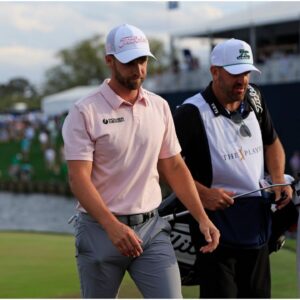 Wyndham Clark and caddie