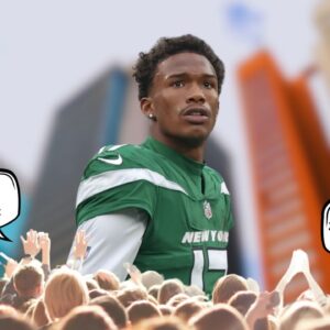 "What Zach Wilson Does to a Man": Garrett Wilson Poses While Dangerously Sitting on the Ledge of a Building & Fans Are Going Berserk