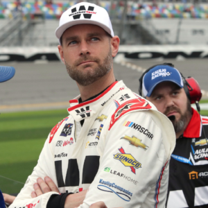 Shane van Gisbergen watches the action on the giant TV screen as he and the crew wait for their qualifying run, Saturday February 17, 2024 for the United Rentals 300 at Daytona International Speedway.