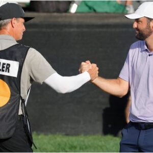 Scottie Scheffler and caddie