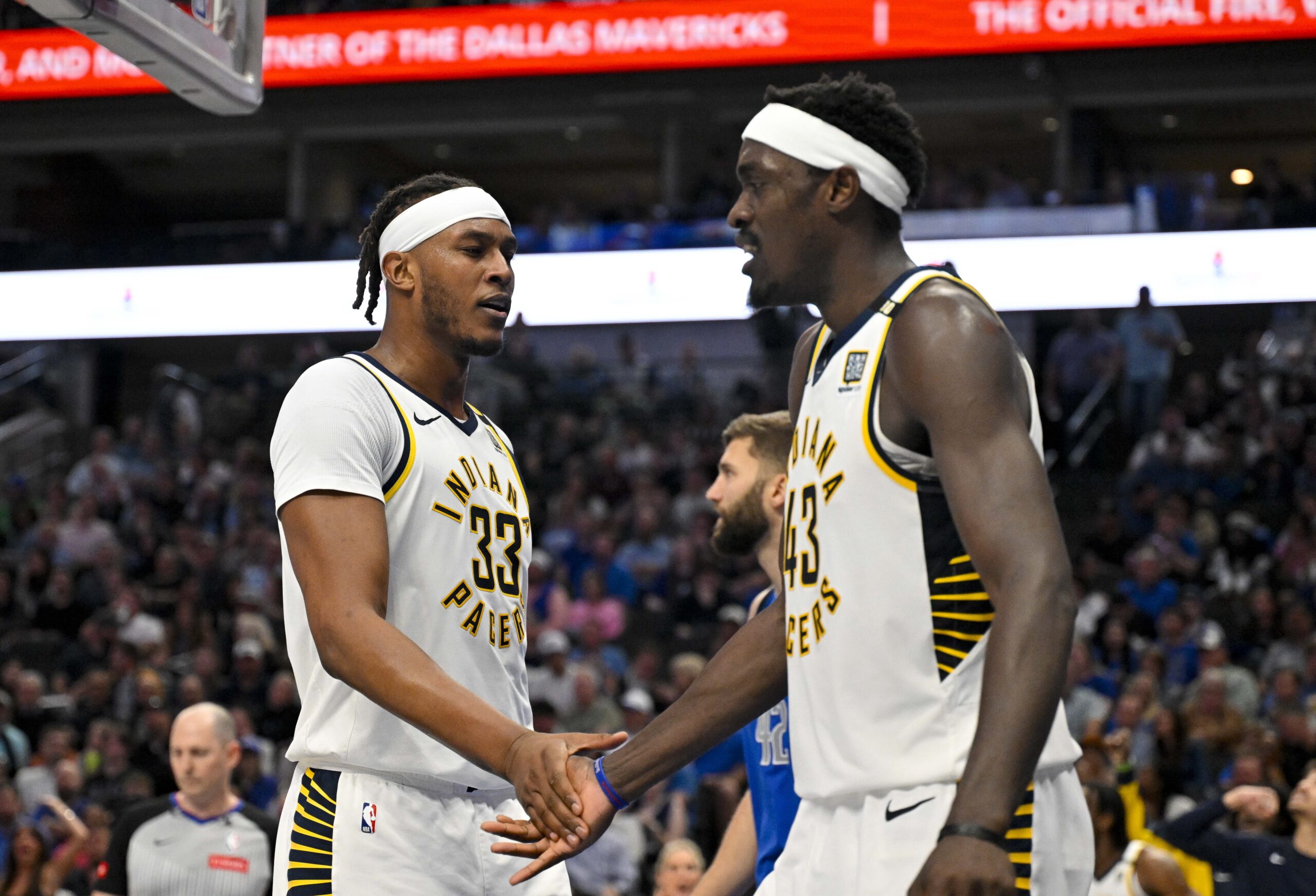 Mar 5, 2024; Dallas, Texas, USA; Indiana Pacers center Myles Turner (33) celebrates with forward Pascal Siakam (43) during the second half against the Dallas Mavericks at the American Airlines Center. Mandatory Credit: Jerome Miron-USA TODAY Sports
