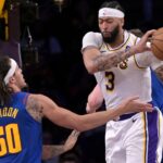 Mar 2, 2024; Los Angeles, California, USA; Los Angeles Lakers forward Anthony Davis (3) reaches in front of Denver Nuggets forward Aaron Gordon (50) for a rebound in the second half at Crypto.com Arena. Mandatory Credit: Jayne Kamin-Oncea-USA TODAY Sports
