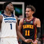 Mar 13, 2023; Atlanta, Georgia, USA; Minnesota Timberwolves guard Anthony Edwards (1) reacts with Atlanta Hawks guard Trae Young (11) during the second half at State Farm Arena. Mandatory Credit: Dale Zanine-USA TODAY Sports