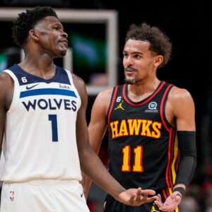 Mar 13, 2023; Atlanta, Georgia, USA; Minnesota Timberwolves guard Anthony Edwards (1) reacts with Atlanta Hawks guard Trae Young (11) during the second half at State Farm Arena. Mandatory Credit: Dale Zanine-USA TODAY Sports