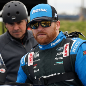 Apr 27, 2024; Dover, Delaware, USA; NASCAR Cup Series driver Chris Buescher climbs into his car during practice and qualifying for the Wurth 400 at Dover Motor Speedway. Mandatory Credit: Matthew O'Haren-USA TODAY Sports
