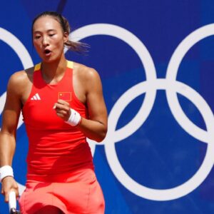 Qinwen Zheng reacts after winning a point at the Olympics 2024