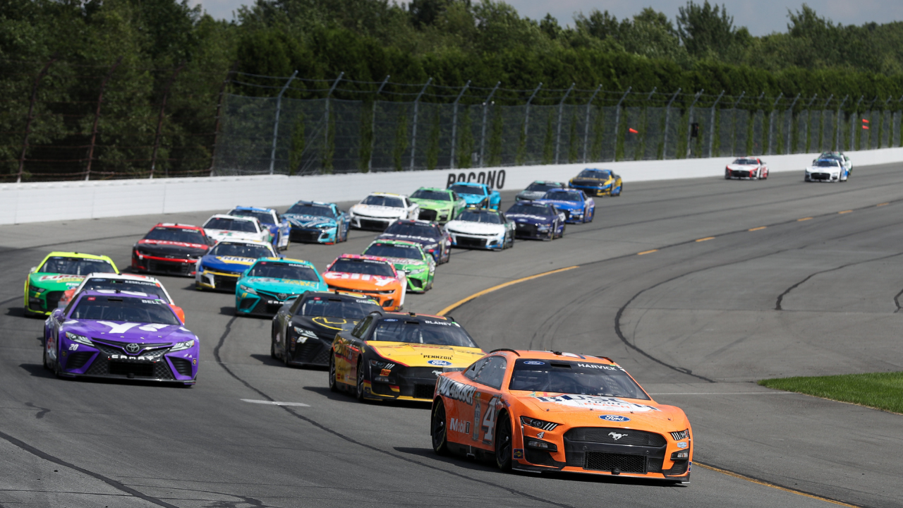 Jul 23, 2023; Long Pond, Pennsylvania, USA; NASCAR Cup Series driver Kevin Harvick (4) leads a pack of cars during the HighPoint.com 400 at Pocono Raceway. Mandatory Credit: Matthew O'Haren-USA TODAY Sports