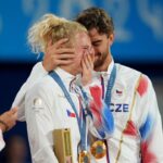 Katerina Siniakova (CZE) and Tomas Machac (CZE) celebrate after winning the mixed doubles gold medal during the Paris 2024 Olympic Summer Games at Stade Roland Garros. Mandatory Credit: Amber Searls-USA TODAY Sports
