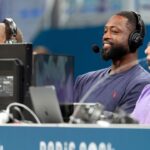 Dwyane Wade and Noah Eagle during the Paris Olympics