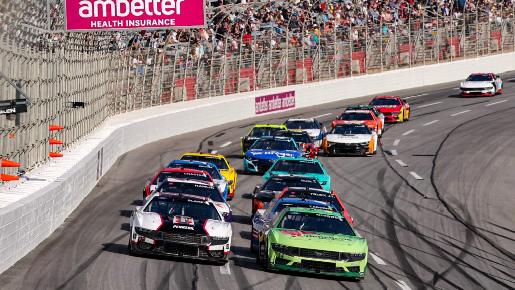 Feb 25, 2024; Hampton, Georgia, USA; NASCAR Cup Series driver Michael McDowell (34) battles with NASCAR Cup Series driver Ryan Blaney (12) during the Ambetter Health 400 at Atlanta Motor Speedway. Mandatory Credit: David Yeazell-Imagn Images