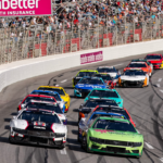 Feb 25, 2024; Hampton, Georgia, USA; NASCAR Cup Series driver Michael McDowell (34) battles with NASCAR Cup Series driver Ryan Blaney (12) during the Ambetter Health 400 at Atlanta Motor Speedway. Mandatory Credit: David Yeazell-Imagn Images