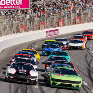 Feb 25, 2024; Hampton, Georgia, USA; NASCAR Cup Series driver Michael McDowell (34) battles with NASCAR Cup Series driver Ryan Blaney (12) during the Ambetter Health 400 at Atlanta Motor Speedway. Mandatory Credit: David Yeazell-Imagn Images