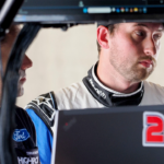 NASCAR Cup Series driver Chase Briscoe (14) stands in his garage Friday, July 19, 2024, during practice for the Brickyard 400 at Indianapolis Motor Speedway. © Bob Goshert/For IndyStar / USA TODAY NETWORK