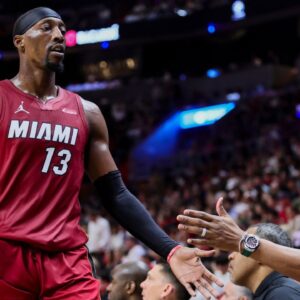 Bam Adebayo daps up Caron Butler