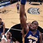 Shaquille O'Neal dunking during a game against the Spurs