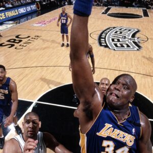 Shaquille O'Neal dunking during a game against the Spurs
