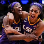 LSU Lady Tigers guard Flau'jae Johnson, left, celebrates with forward Angel Reese after defeating the Virginia Tech Hokies in semifinals of the women's Final Four of the 2023 NCAA Tournament at American Airlines Center. Mandatory Credit: Kirby Lee-Imagn Images