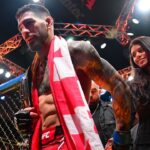 Ilia Topuria celebrates his championship victory against Alexander Volkanovski during UFC 298 at Honda Center.