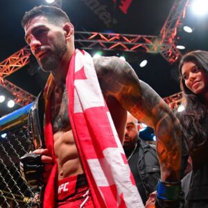 Ilia Topuria celebrates his championship victory against Alexander Volkanovski during UFC 298 at Honda Center.