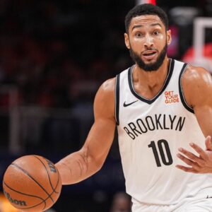 Brooklyn Nets guard Ben Simmons (10) directs teammates while controlling the ball during the first half at State Farm Arena.