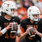 Texas Longhorns quarterbacks Arch Manning (16), left, and Quinn Ewers (3) throw passes while warming up ahead of the Longhorns' spring Orange and White game at Darrell K Royal Texas Memorial Stadium in Austin, Texas.