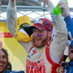 Sprint Cup Series driver Dale Earnhardt Jr. (88) celebrates winning the Goody's Headache Relief Shot 500 at Martinsville Speedway.