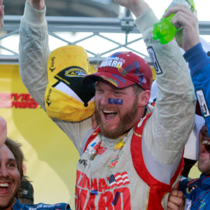 Sprint Cup Series driver Dale Earnhardt Jr. (88) celebrates winning the Goody's Headache Relief Shot 500 at Martinsville Speedway.