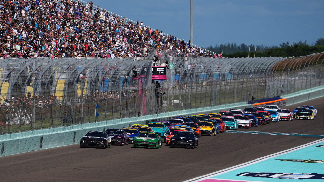 Oct 27, 2024; Homestead, Florida, USA; NASCAR Cup Series driver Kyle Busch (8) and NASCAR Cup Series driver Joey Logano (22) lead the field to restart the Straight Talk Wireless 400 at Homestead-Miami Speedway. Mandatory Credit: Jasen Vinlove-Imagn Images