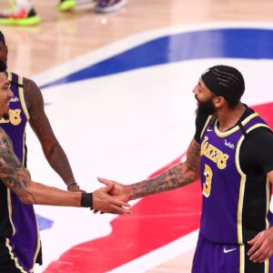 Los Angeles Lakers players Kentavious Caldwell-Pope (1) , Danny Green (14) and Anthony Davis (3) celebrate after defeating the Denver Nuggets in game five of the Western Conference Finals of the 2020 NBA Playoffs at AdventHealth Arena.