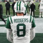 New York Jets quarterback Aaron Rodgers (8) warms up before the game against the Buffalo Bills at MetLife Stadium.