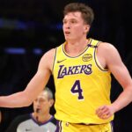 Los Angeles Lakers guard Dalton Knecht (4) dribbles during the second quarter against the Minnesota Timberwolves at Crypto.com Arena