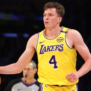 Los Angeles Lakers guard Dalton Knecht (4) dribbles during the second quarter against the Minnesota Timberwolves at Crypto.com Arena