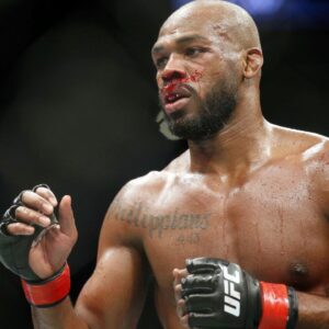 Jon Jones (red gloves) fights Dominick Reyes (not pictured) during UFC 247 at Toyota Center.