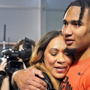 Ohio State quarterback C.J. Stroud hugs his mother, Kim, after his workout on the Buckeyes' pro day. CJ Stroud