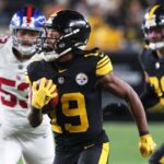 Pittsburgh Steelers wide receiver Calvin Austin III (19) scores a touchdown on a seventy-five yard punt return against the New York Giants during the third quarter at Acrisure Stadium.