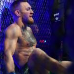 Conor McGregor reacts following an injury suffered against Dustin Poirier during UFC 264 at T-Mobile Arena.