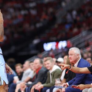 Memphis Grizzlies guard Ja Morant (12) reacts towards fans after scoring a basket during the second quarter against the Houston Rockets at Toyota Center.