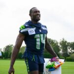 Seattle Seahawks wide receiver DK Metcalf (14) walks off the field after training camp at Virginia Mason Athletic Center.