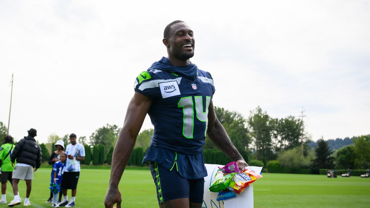 Seattle Seahawks wide receiver DK Metcalf (14) walks off the field after training camp at Virginia Mason Athletic Center.